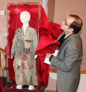 Kevin Blowers, Curator of Bethel College Library, unveiling the Orphan Dress from Hadjin