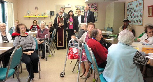 Mayor Sinanyan visits Assisted Living Facility residents in the activity room during Archpriest Fr. Hovsep Hagopian's Bible study session